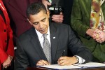 President Obama signing a bill