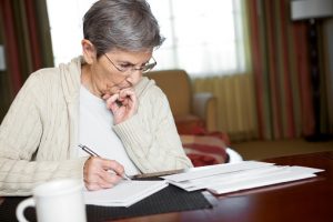 Senior Woman Paying Bills